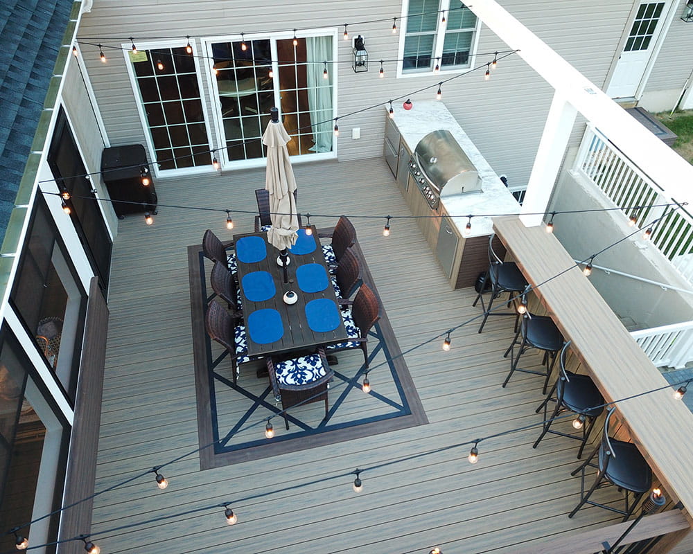 composite decking with outdoor kitchen and lights